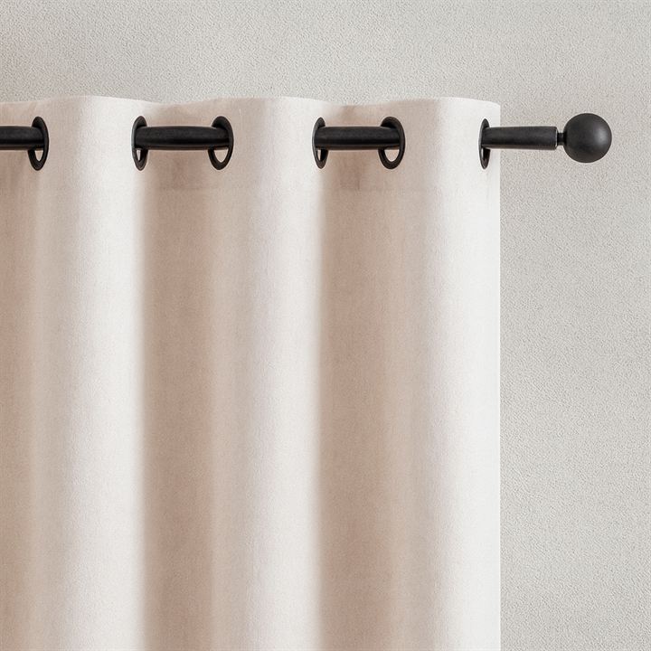 Grommet curtain header on a rod