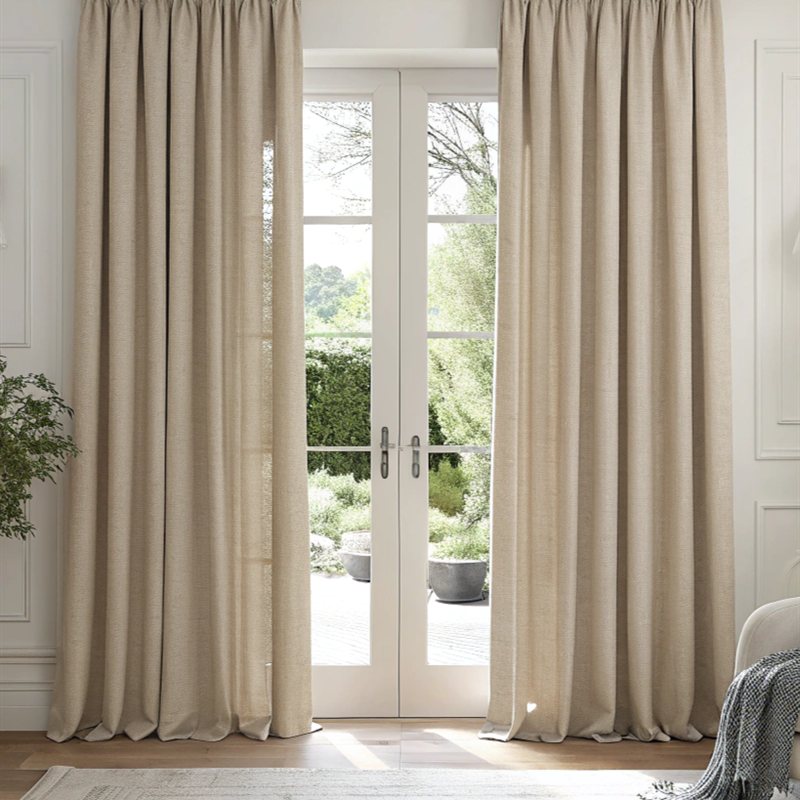 Beige linen curtains framing French doors